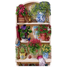 An adult shaped puzzle of wooden shelved with flowers in pots and gardening equipment on them.